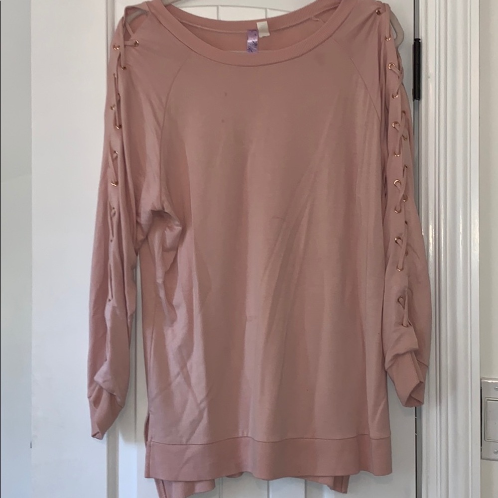 Pink sweater with criss cross design sleeves